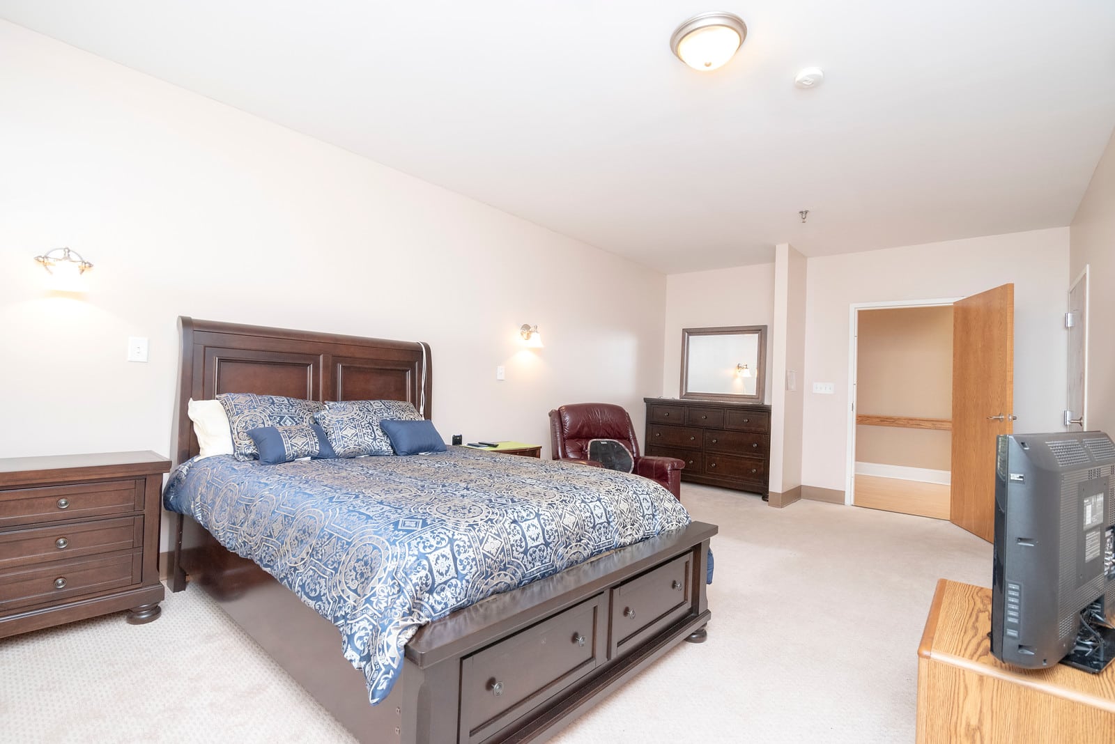 Comfortable private bedroom in assisted living.