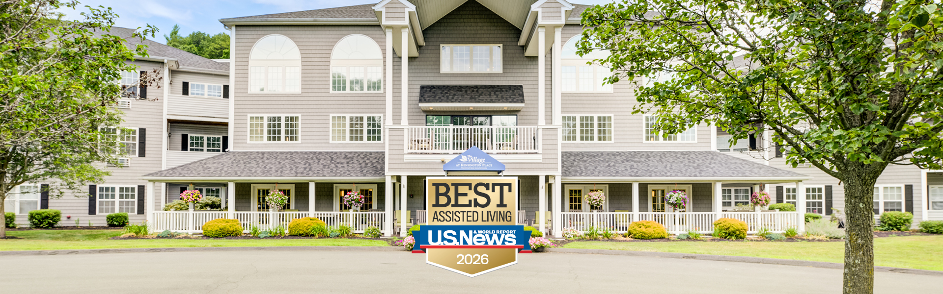 Exterior view of assisted living facility with landscaping.