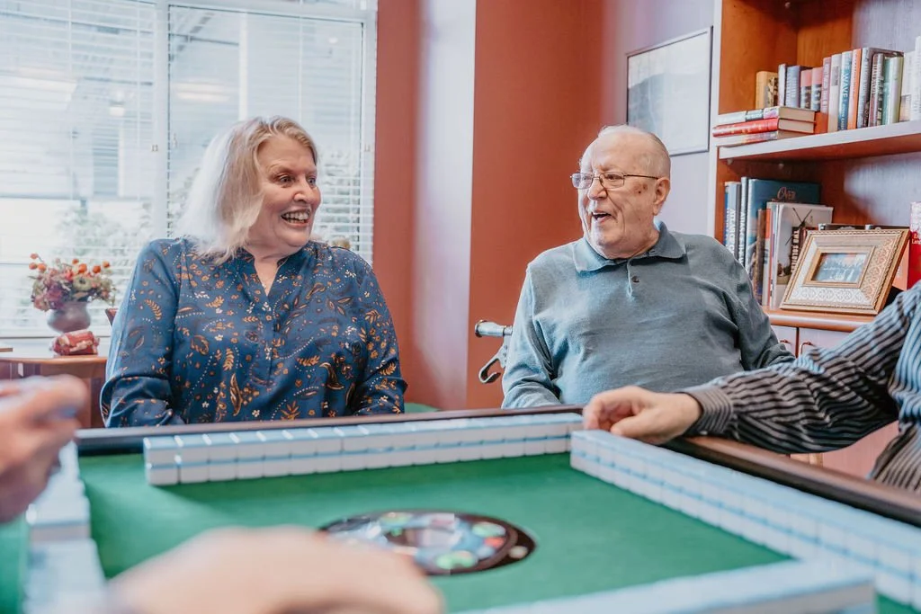 Residents enjoying a game in a common area
