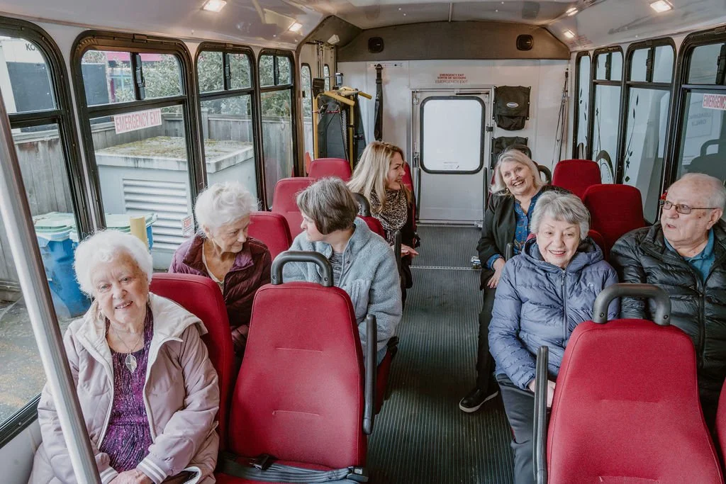 Residents enjoying a ride on the facility's bus.
