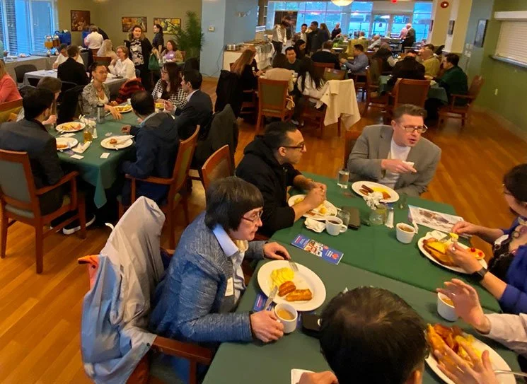 Residents dining together in a communal space