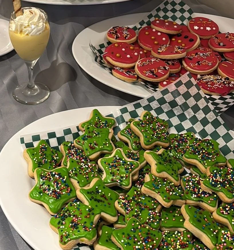 Colorful holiday cookies and dessert display.