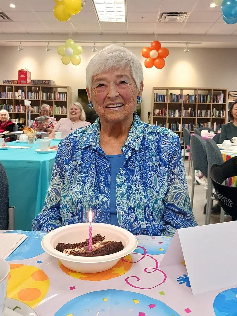 Resident celebrating a birthday with cake.