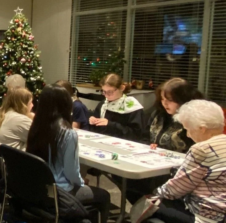 Residents playing games at a holiday gathering.
