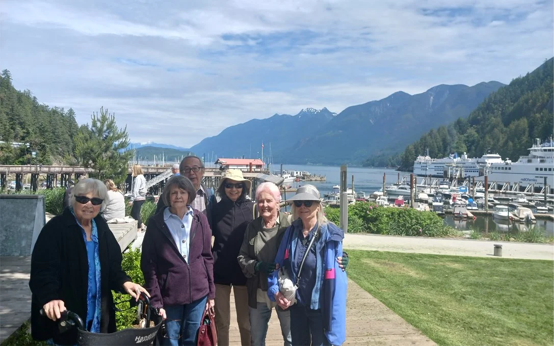 Group of residents enjoying an outdoor area by the water.