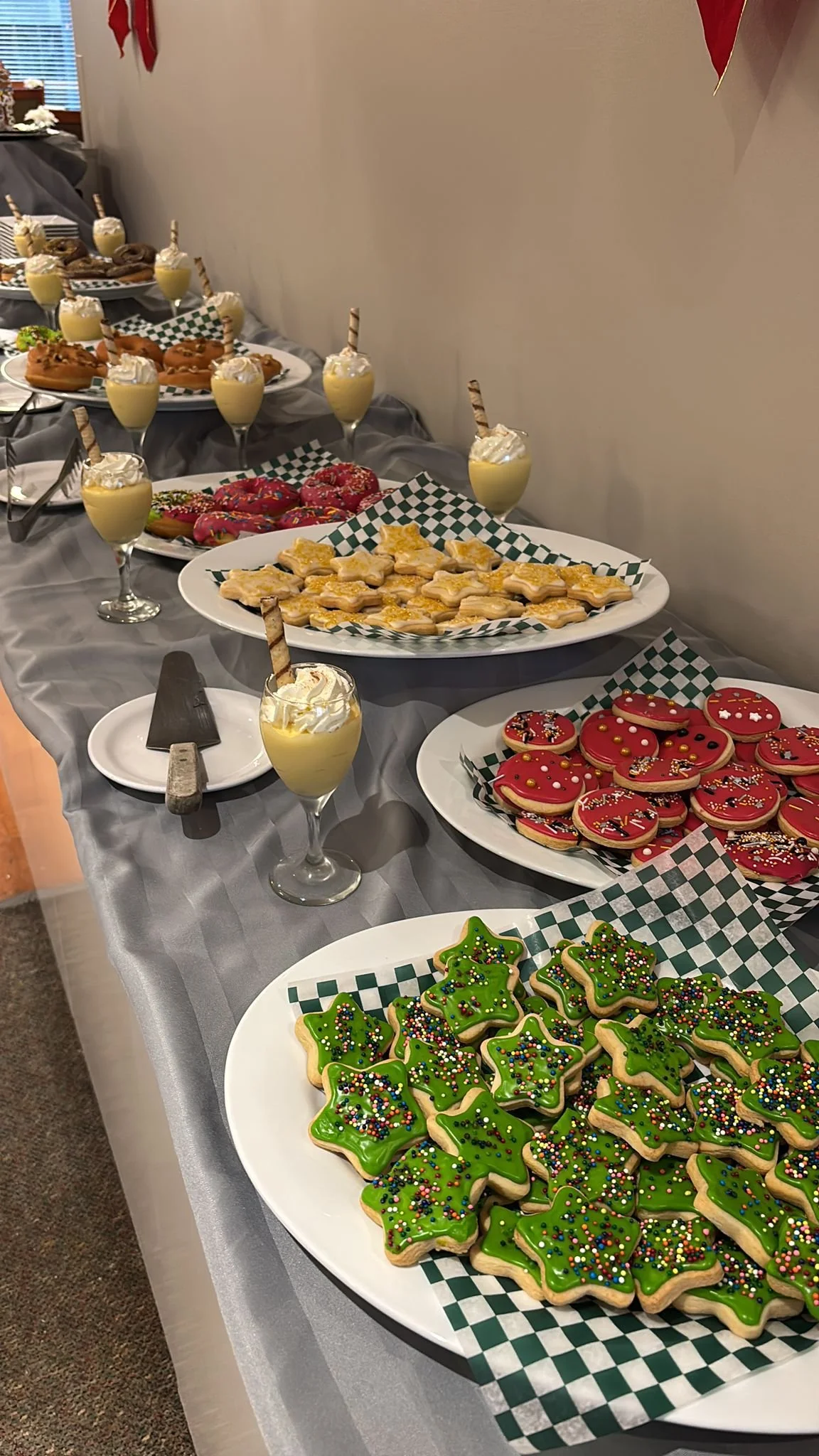Decorated holiday cookies and drinks on a table