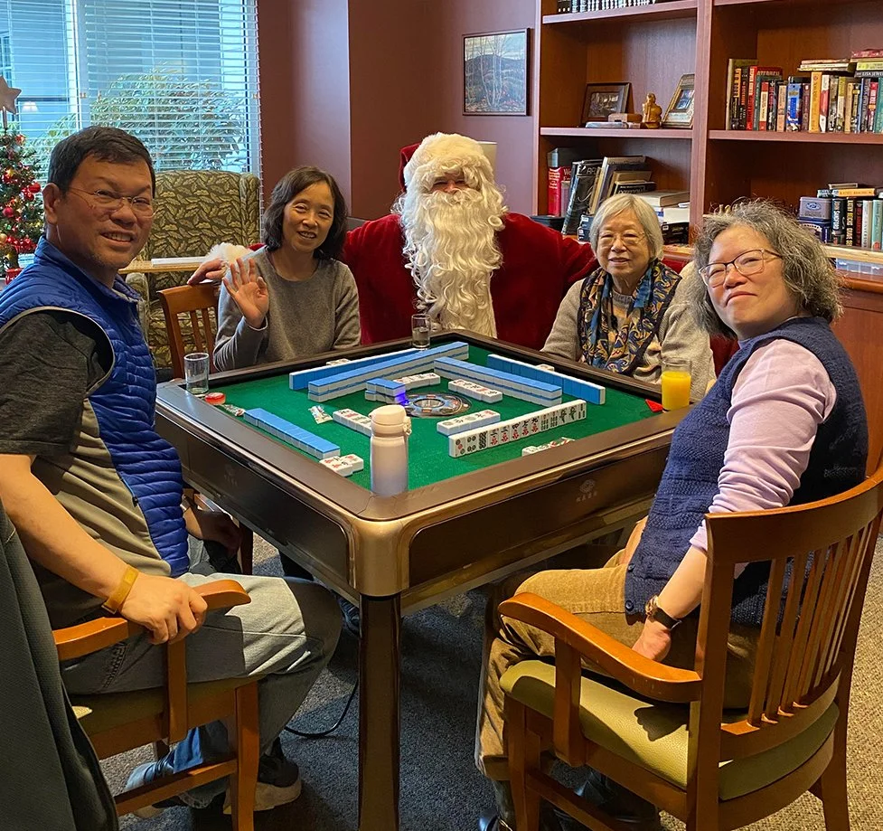 Residents and staff enjoying a festive gathering with Santa.