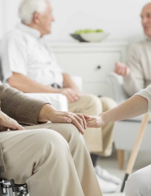 A caregiver interacting with a senior resident.