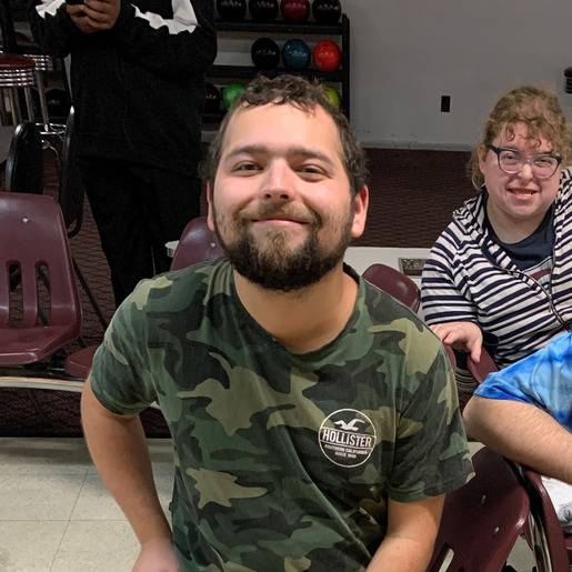 Residents enjoying a bowling event together.