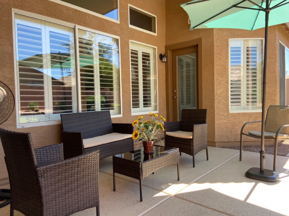 Cozy outdoor seating area with sunflowers and umbrellas