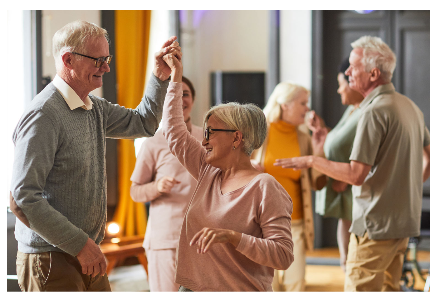 Residents enjoying a dance party in a common area