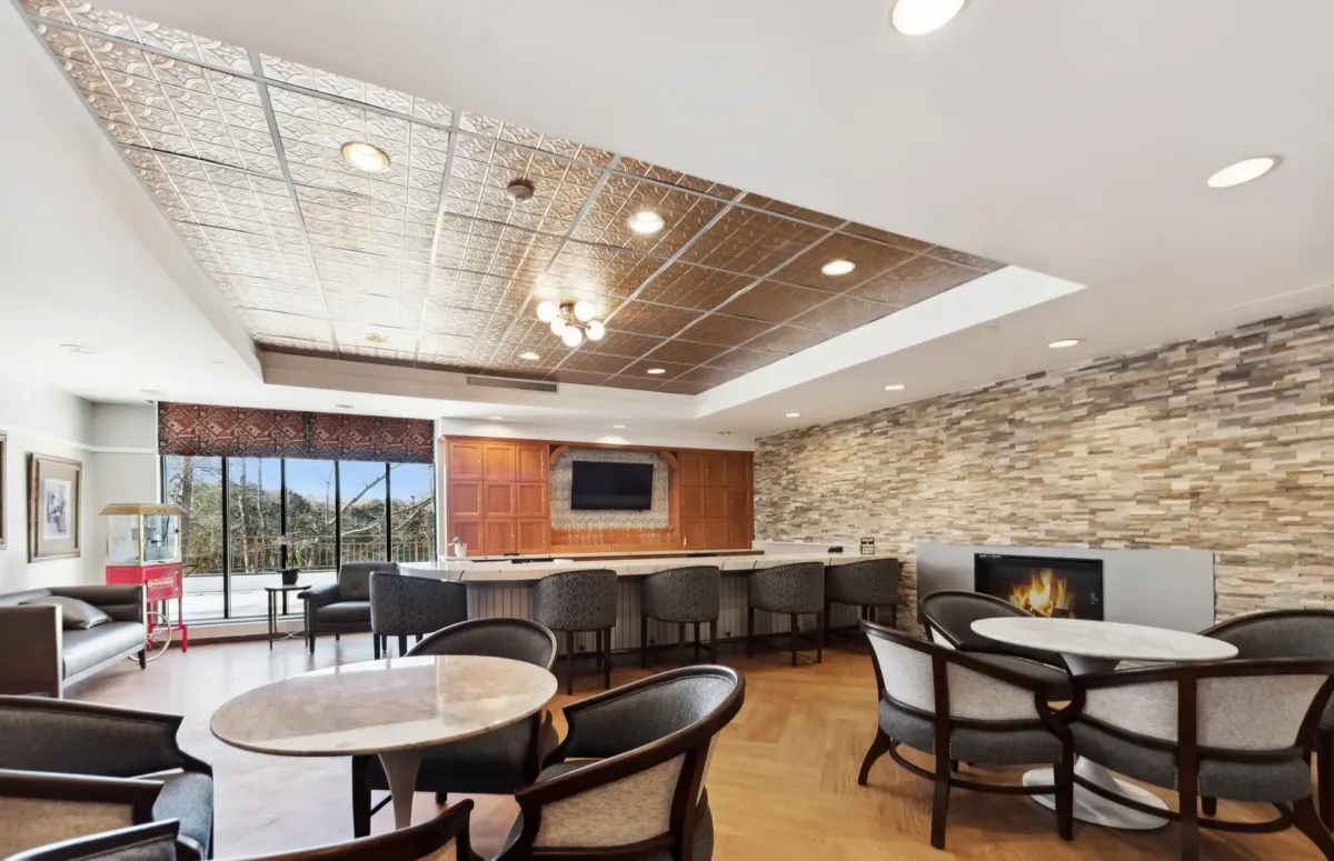 Bright common area with seating and bar