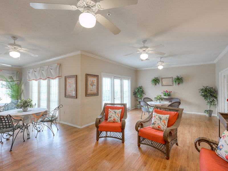 Bright common area with comfortable seating and plants
