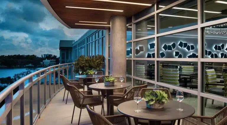 Outdoor seating area with tables and plants