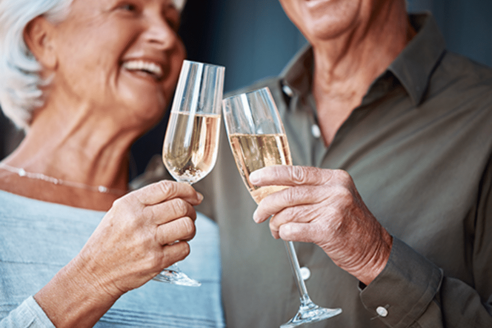 Two residents toasting with champagne glasses