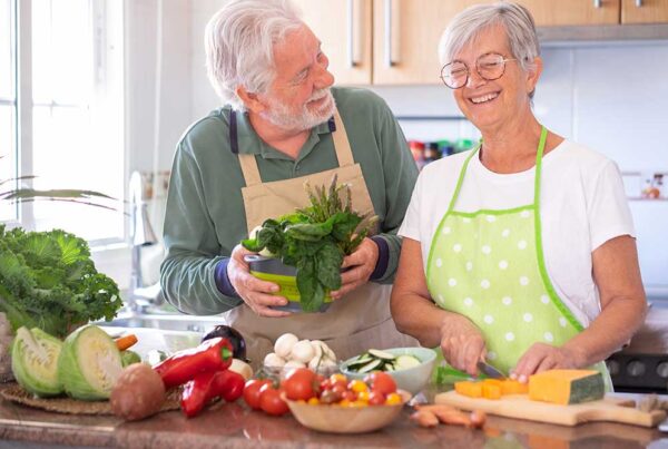 Residents cooking together in a kitchen