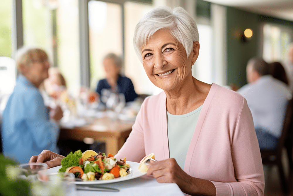 Resident enjoying a meal in a dining area