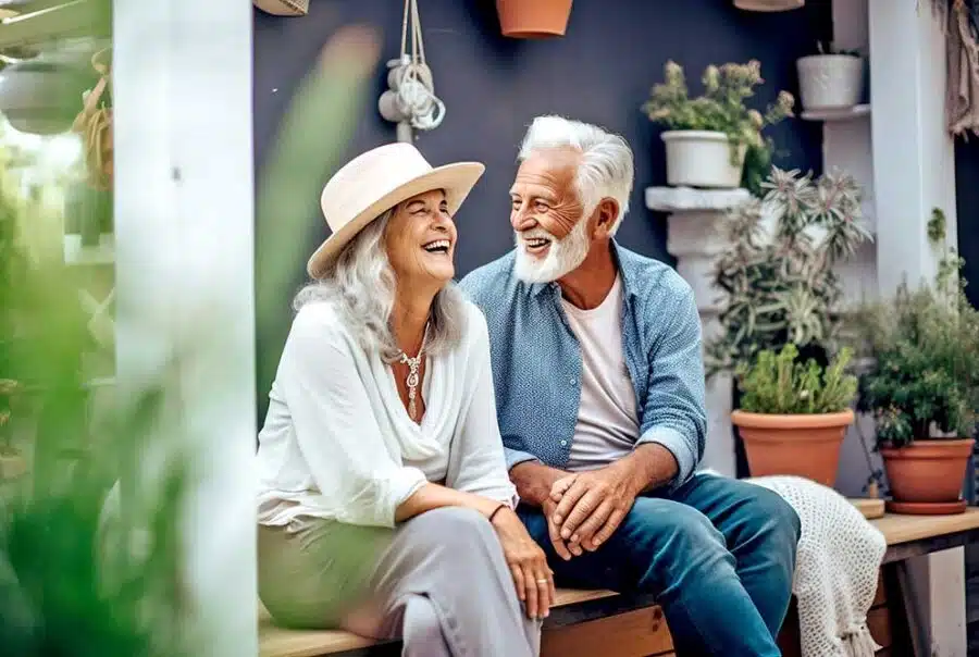 Seniors laughing together in a garden setting