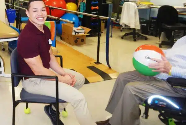Staff member engaging with a resident during a therapy session