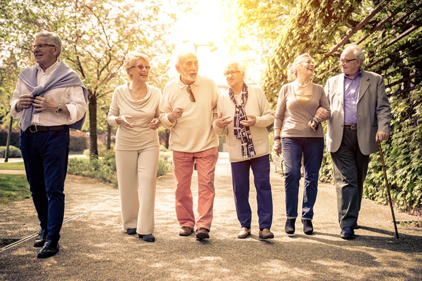 Residents walking together in a sunny outdoor setting