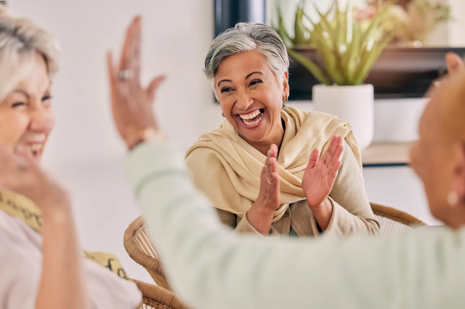 Residents enjoying a lively conversation in a common area
