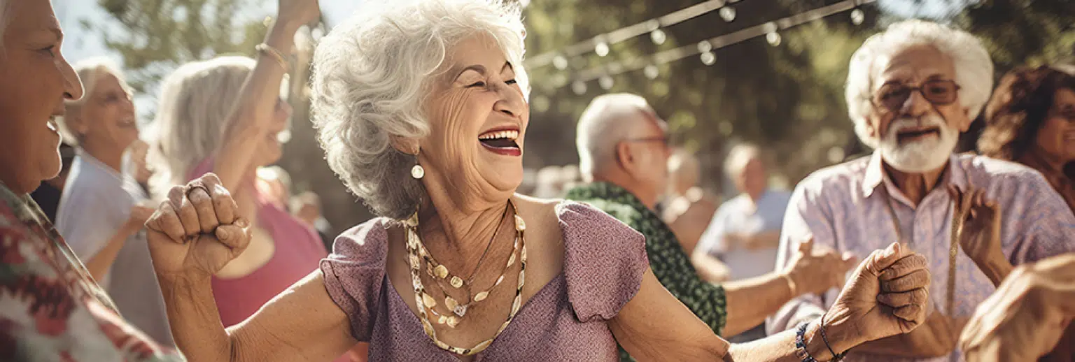 Residents dancing joyfully at an outdoor event
