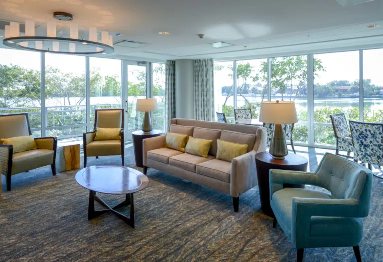 Bright common area with seating and large windows