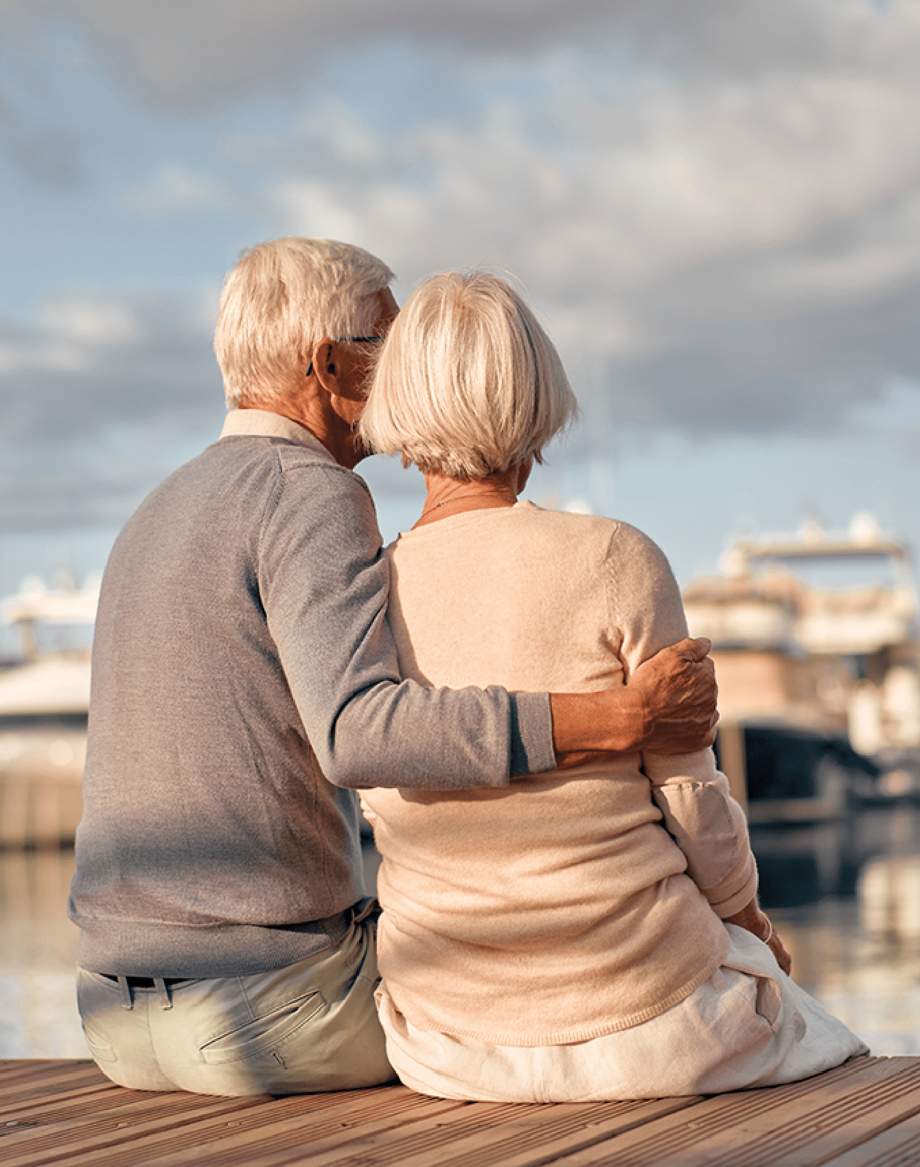A senior couple enjoying a peaceful moment by the bay