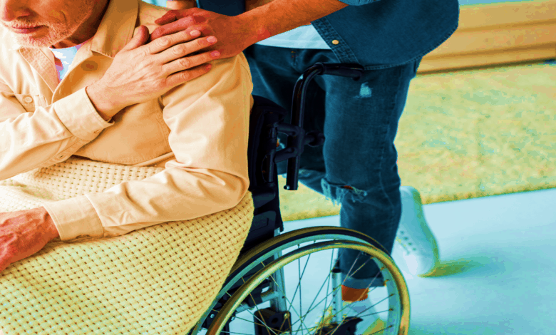 Caregiver assisting a resident in a wheelchair.