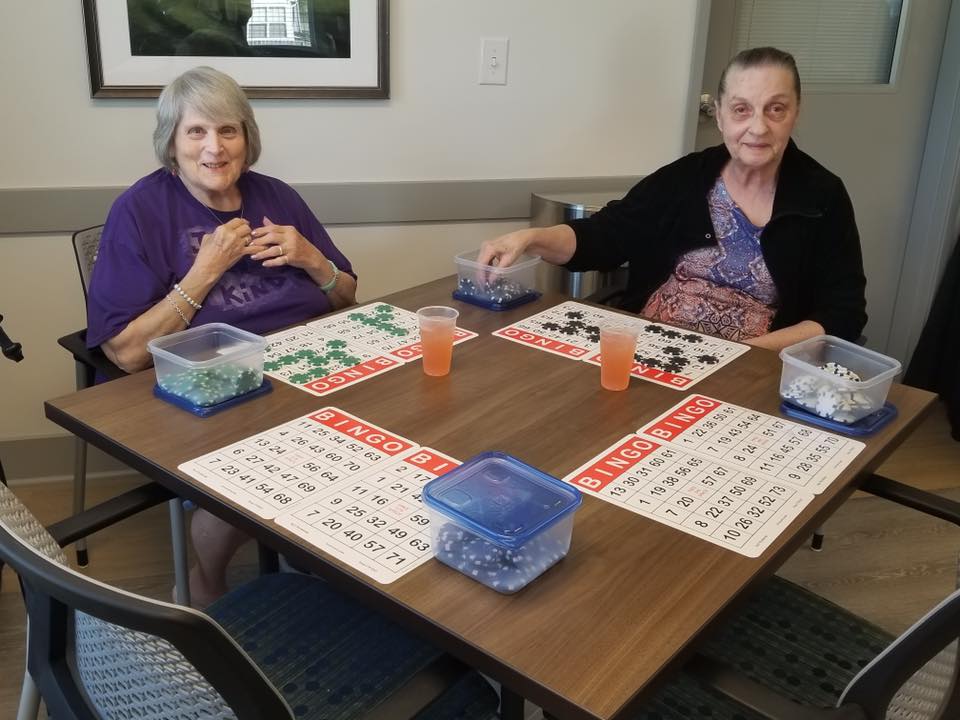 Two residents playing bingo at a table