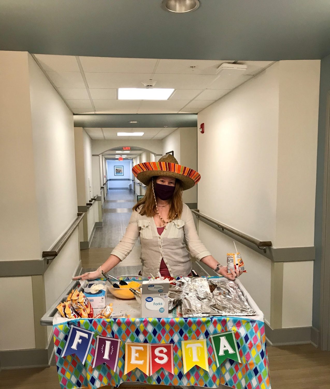 Staff member serving snacks at a festive event