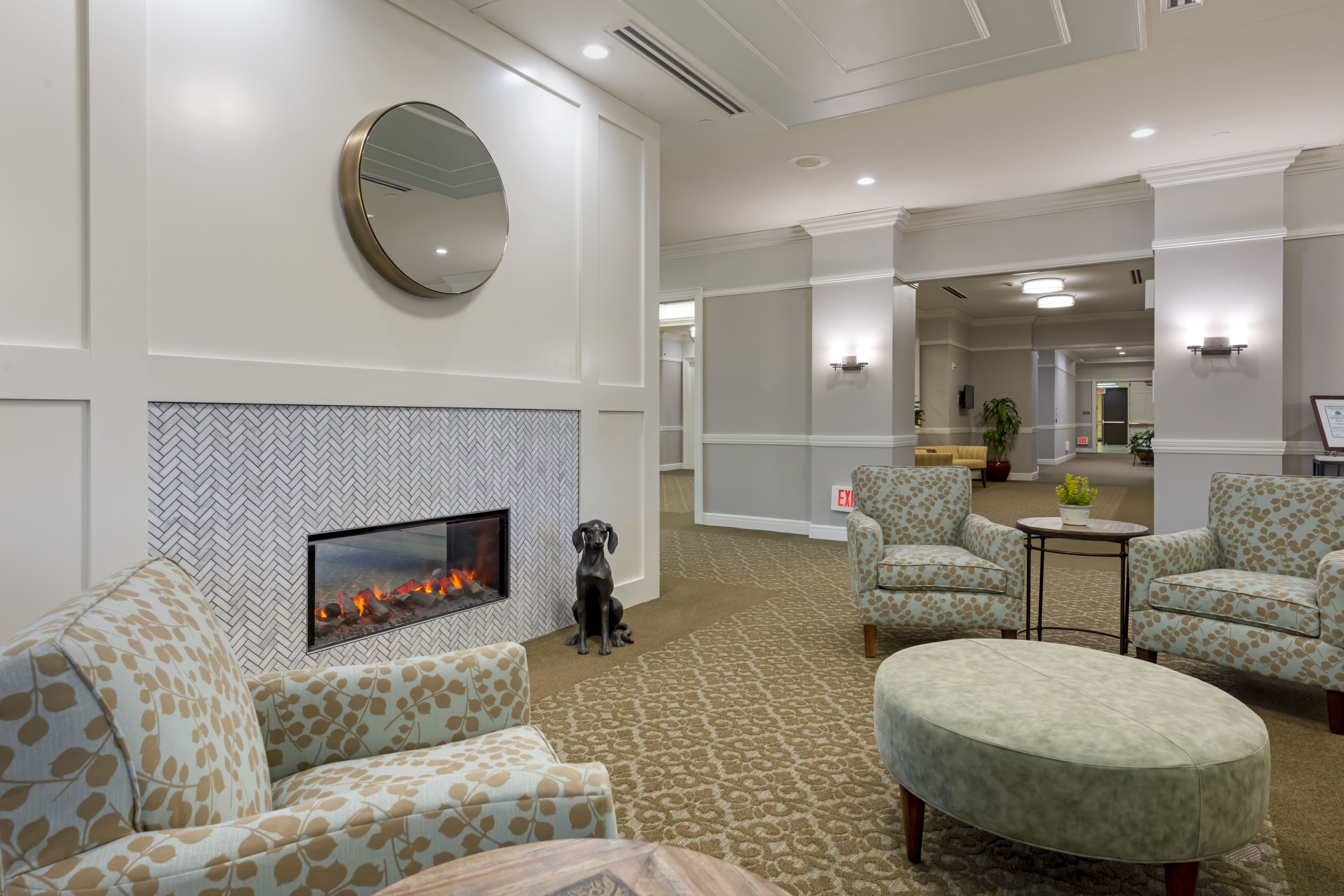 Cozy common area with seating and a dog
