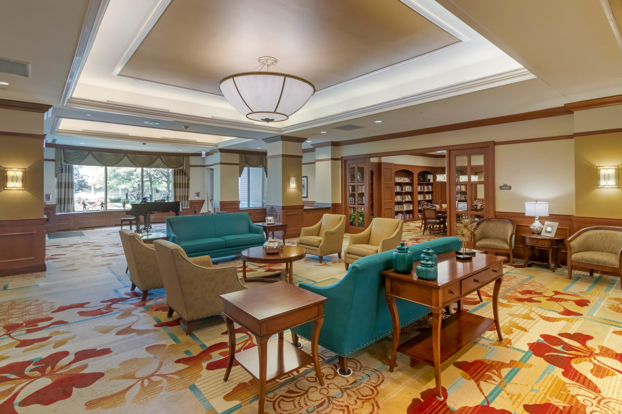 Interior view of a lounge area with seating and bookshelves