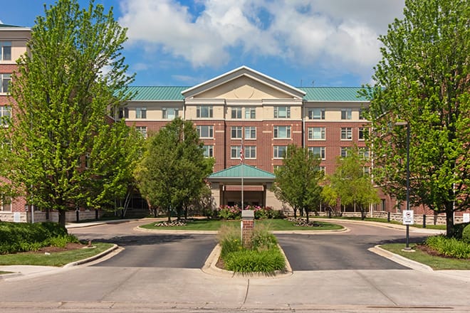 Exterior view of Brookdale Glen Ellyn with greenery
