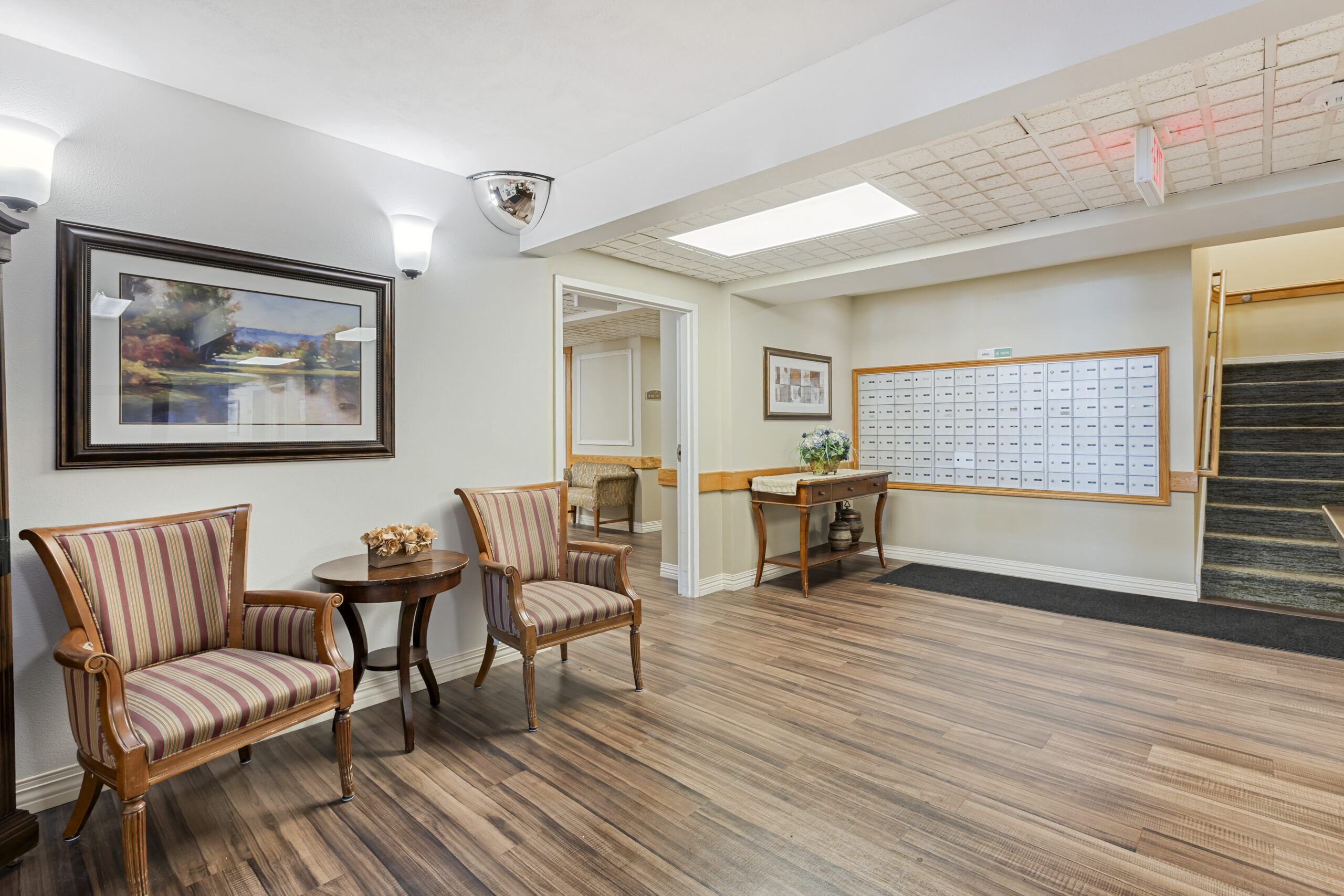 Interior view of a common area with seating and mailboxes