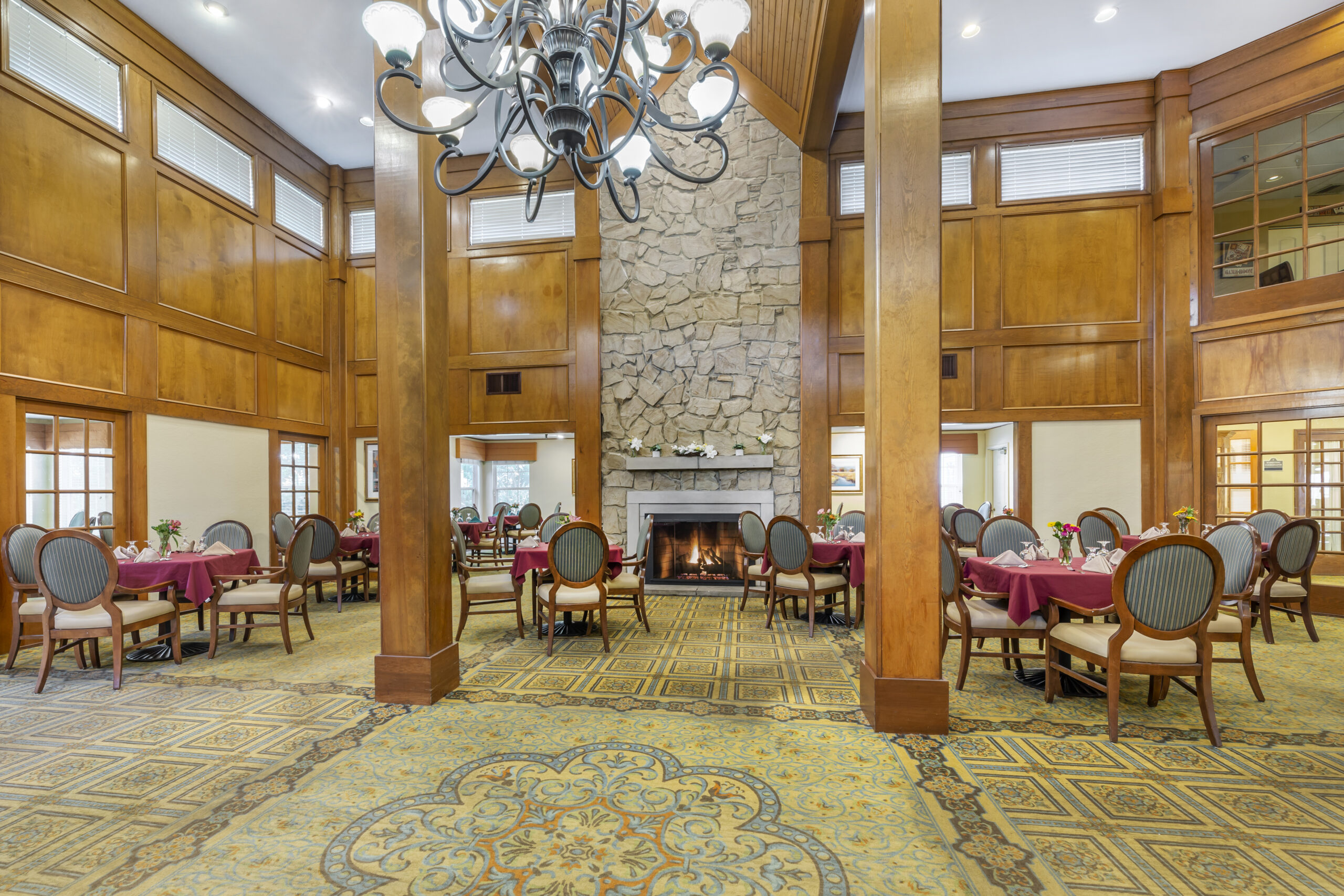Dining area with tables and a fireplace