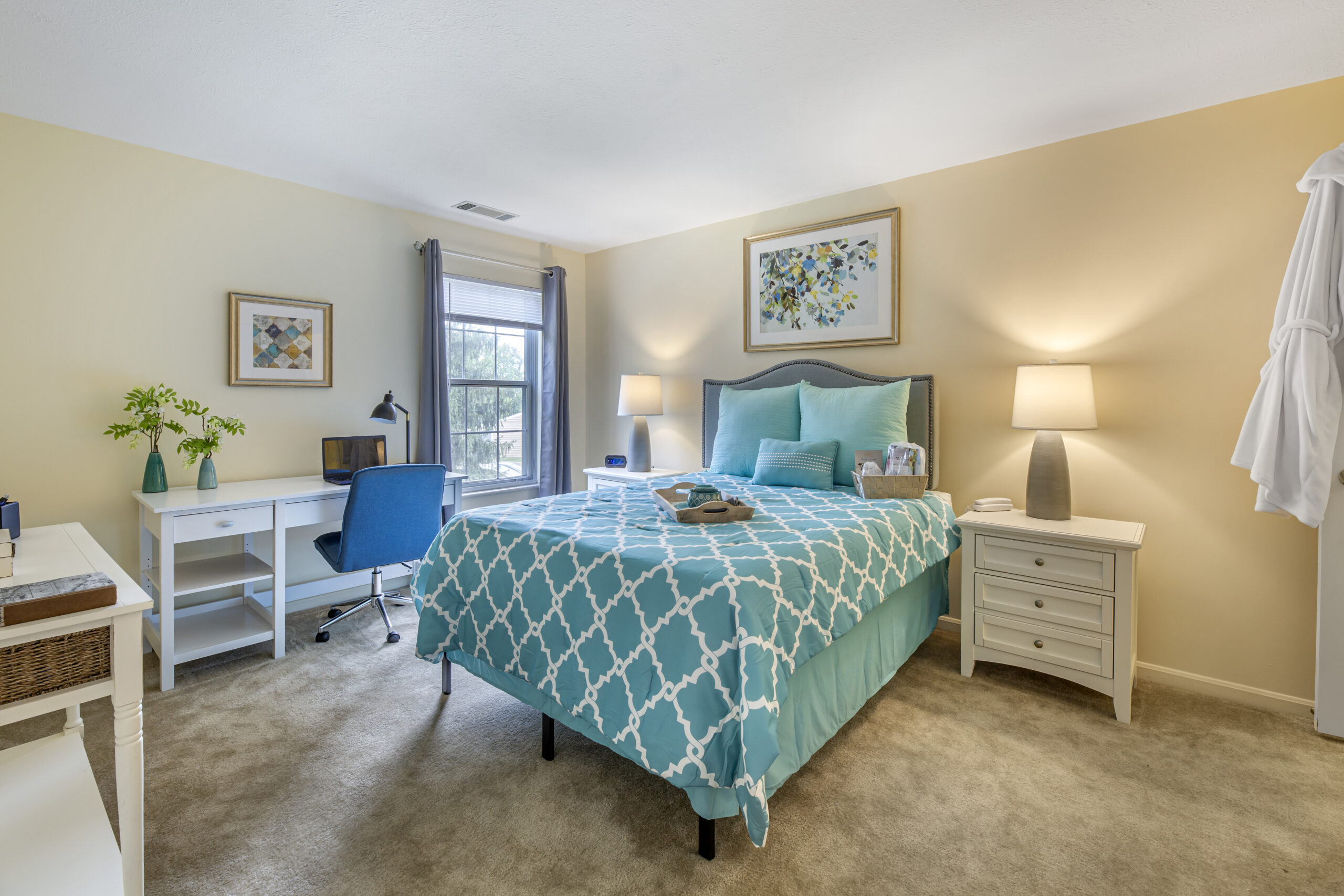 Cozy resident room with a bed and desk