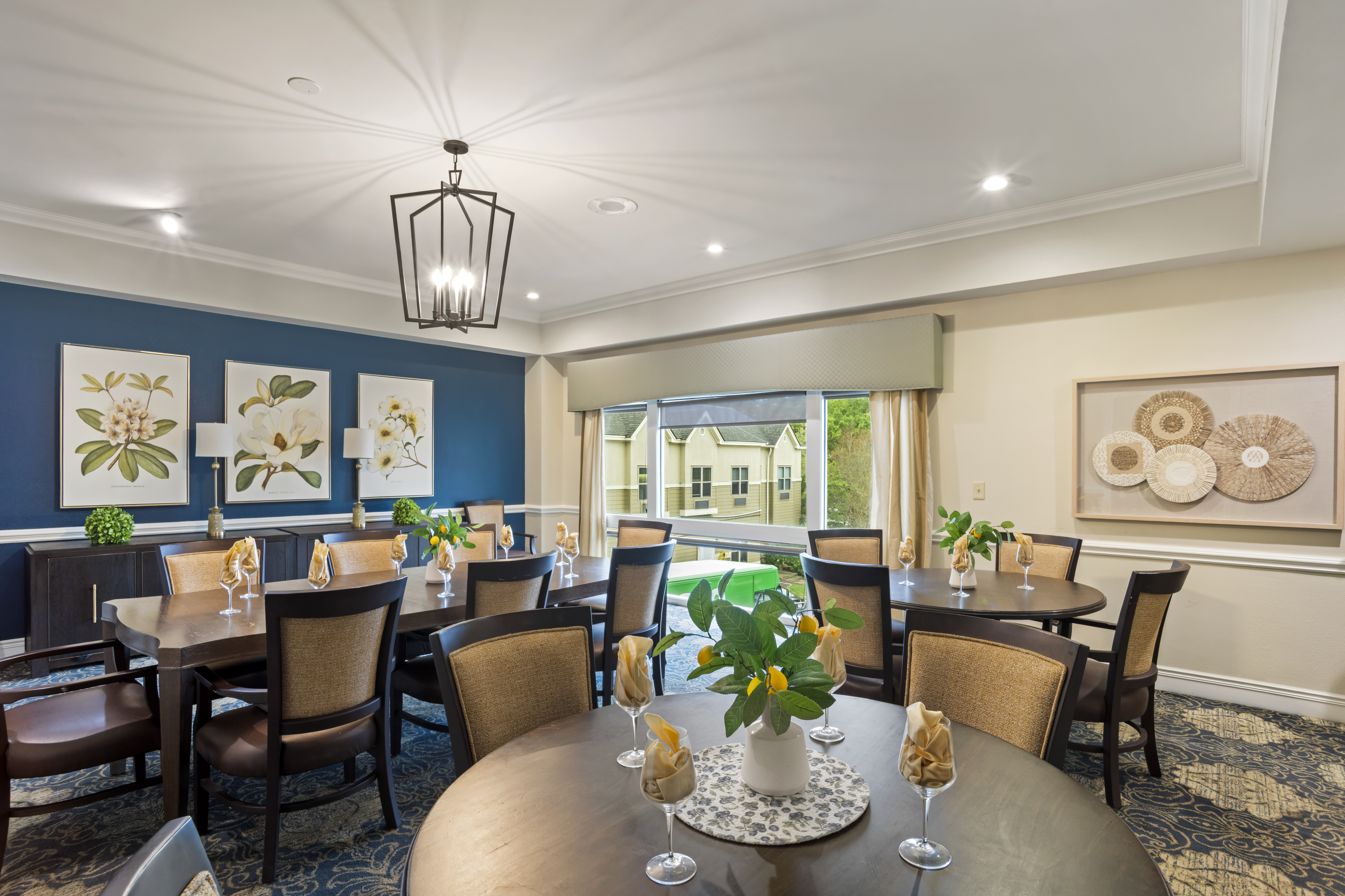 Bright dining room with tables and decorative plants