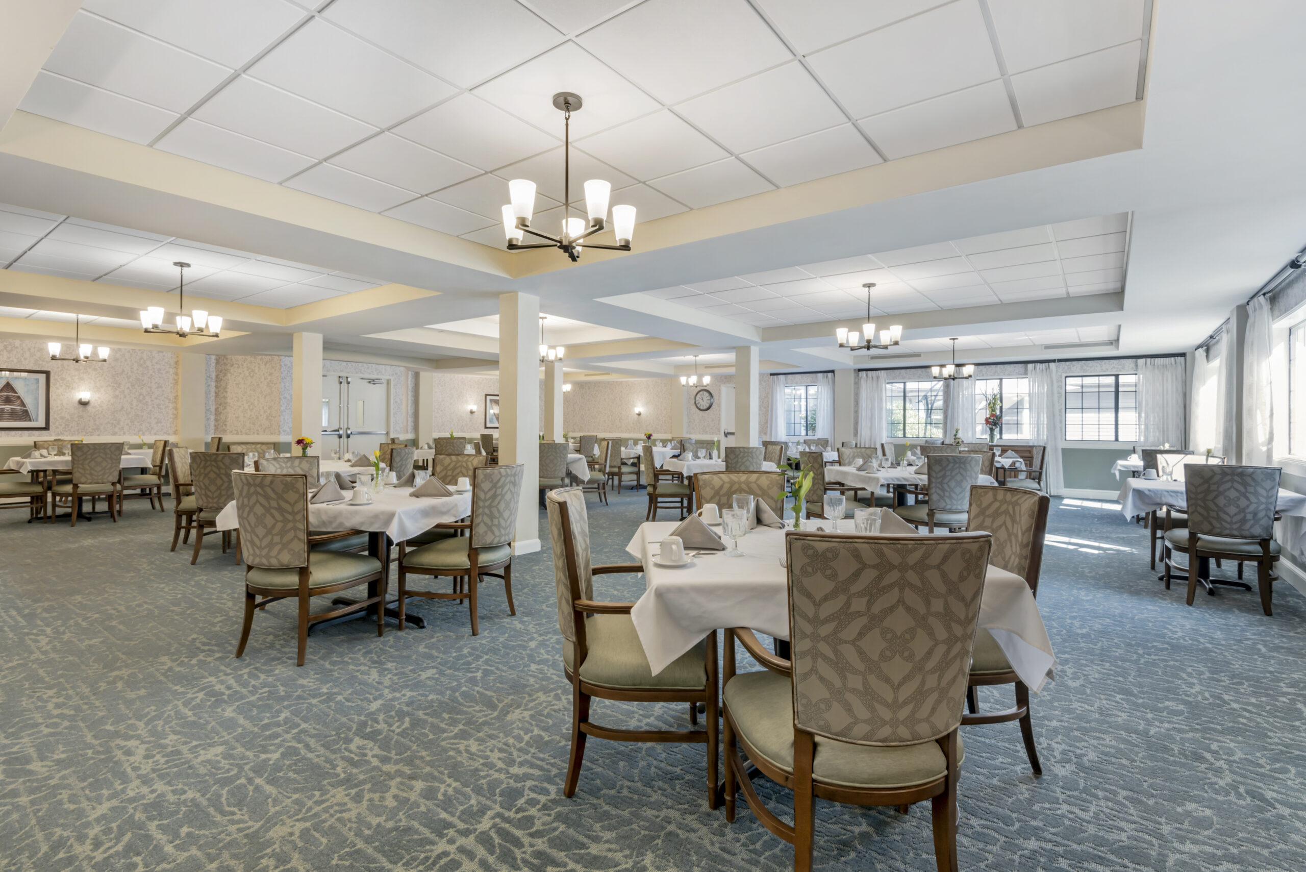 Dining room with neatly set tables and elegant decor