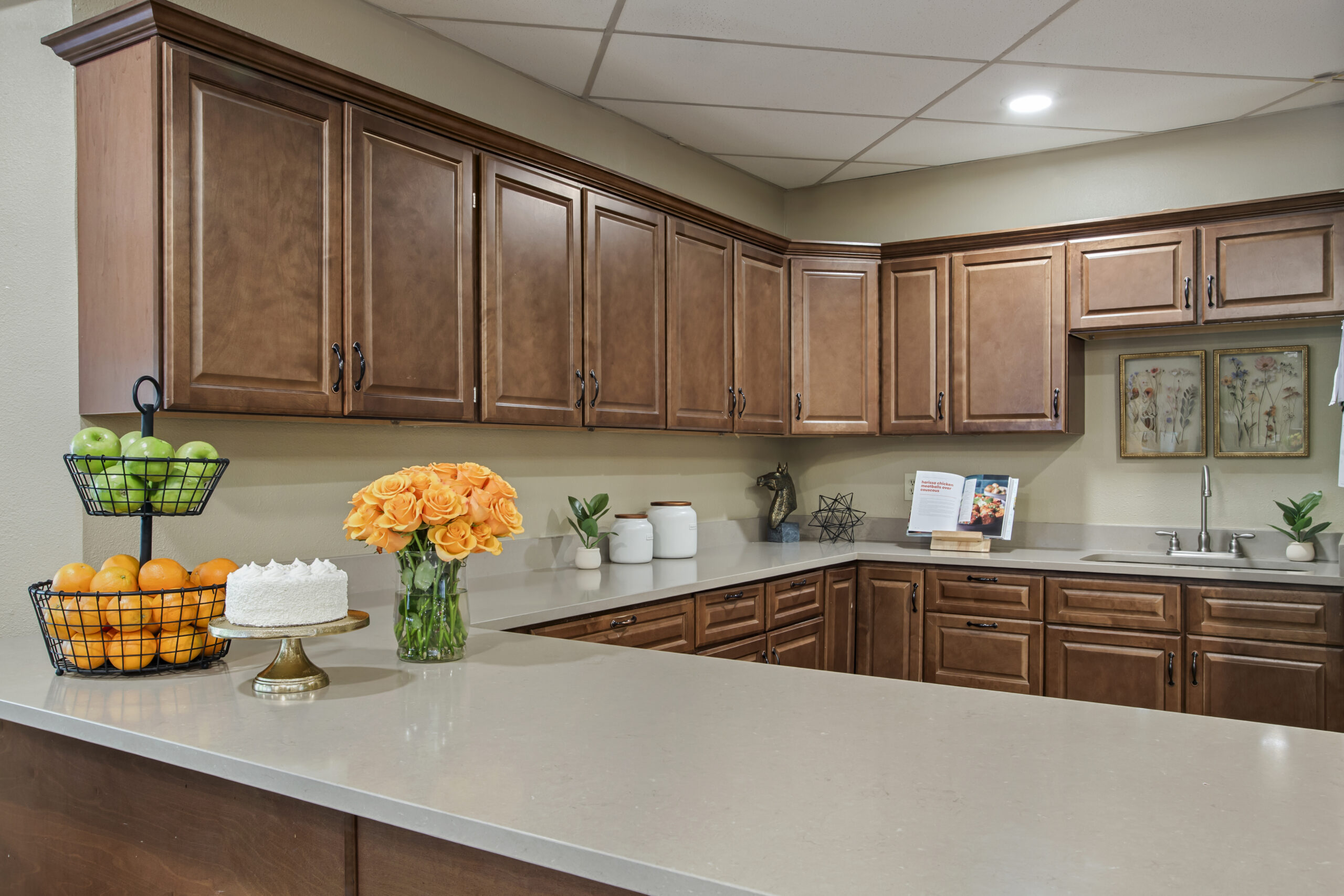 Interior kitchen area with cabinets and fruit display