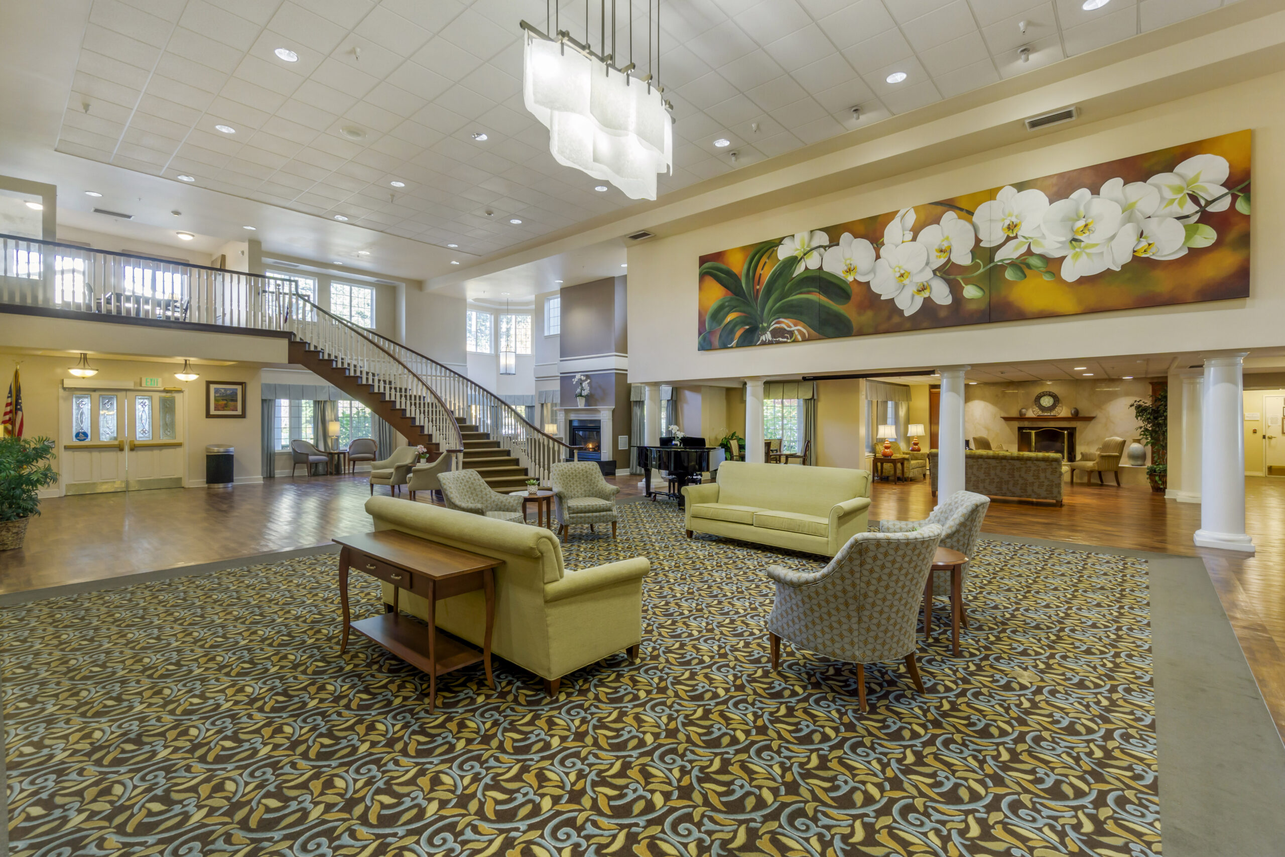 Bright common area with seating and decorative artwork