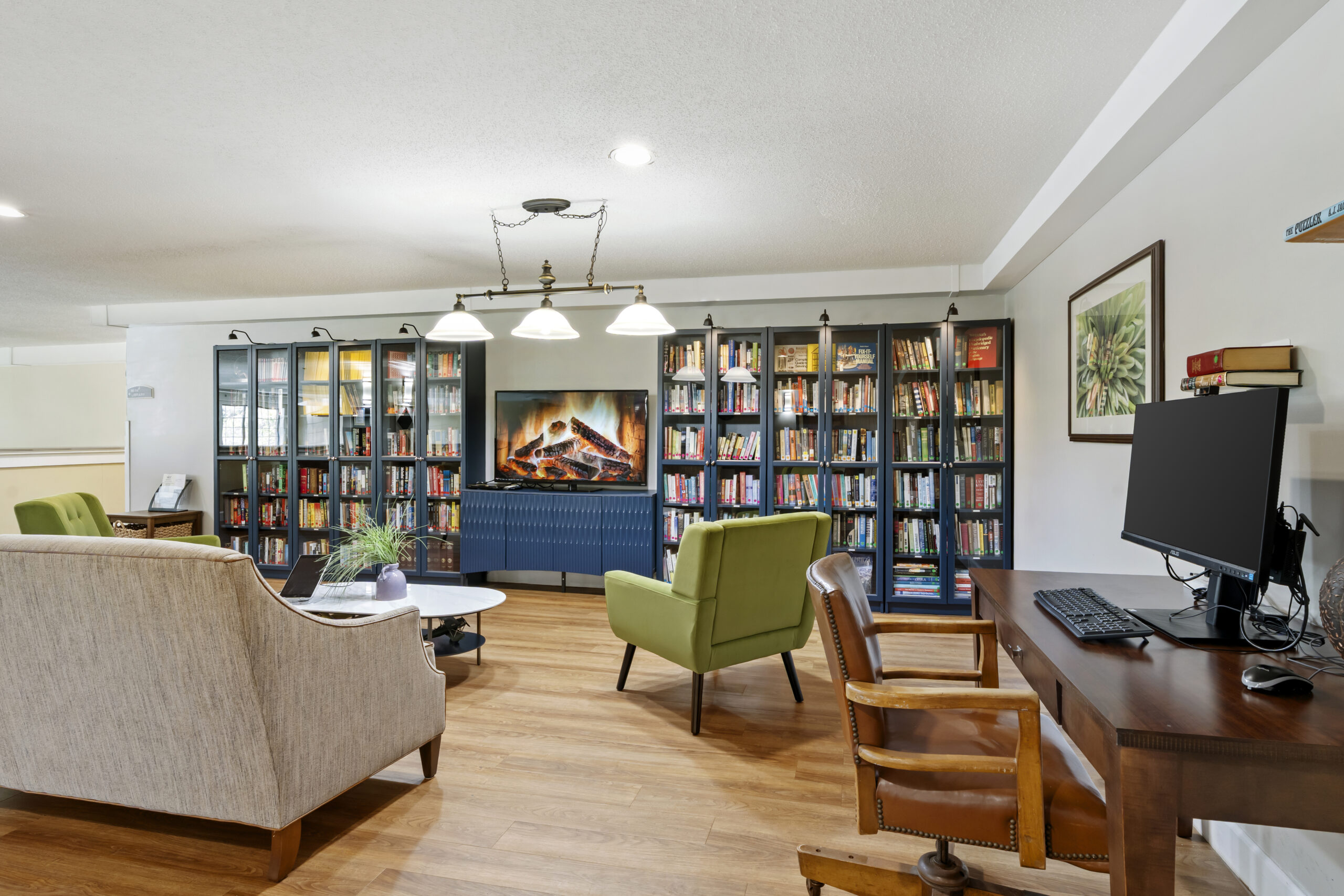 Cozy common area with bookshelves and seating