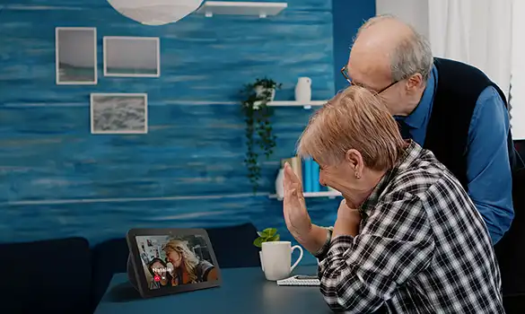 Residents engaging over video call in a cozy living area
