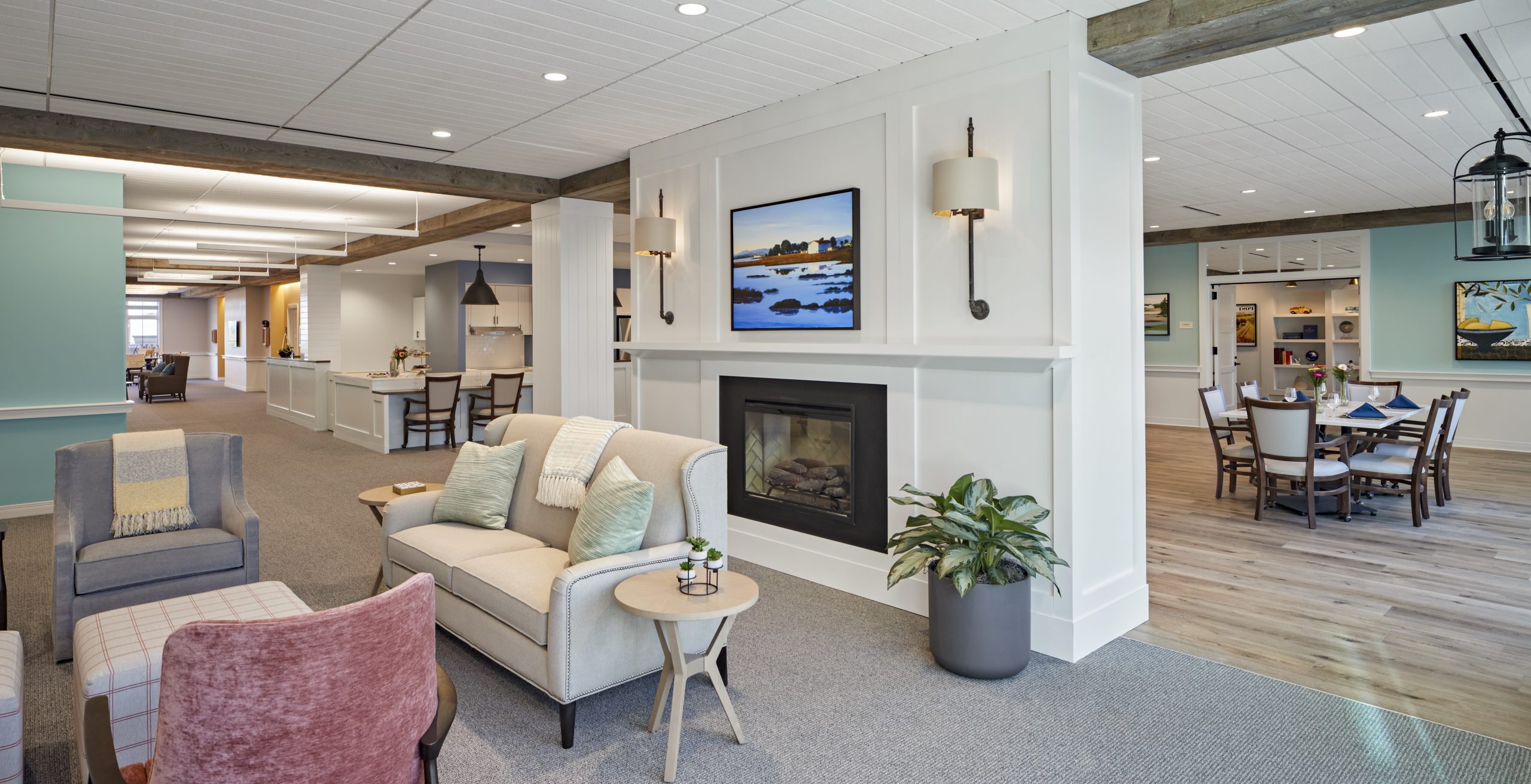 Bright and welcoming common area with seating and artwork