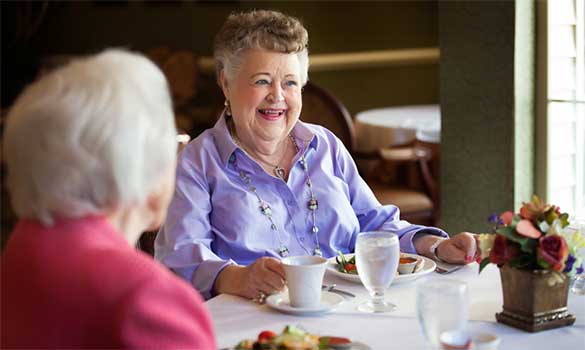Residents enjoying lunch in a dining area