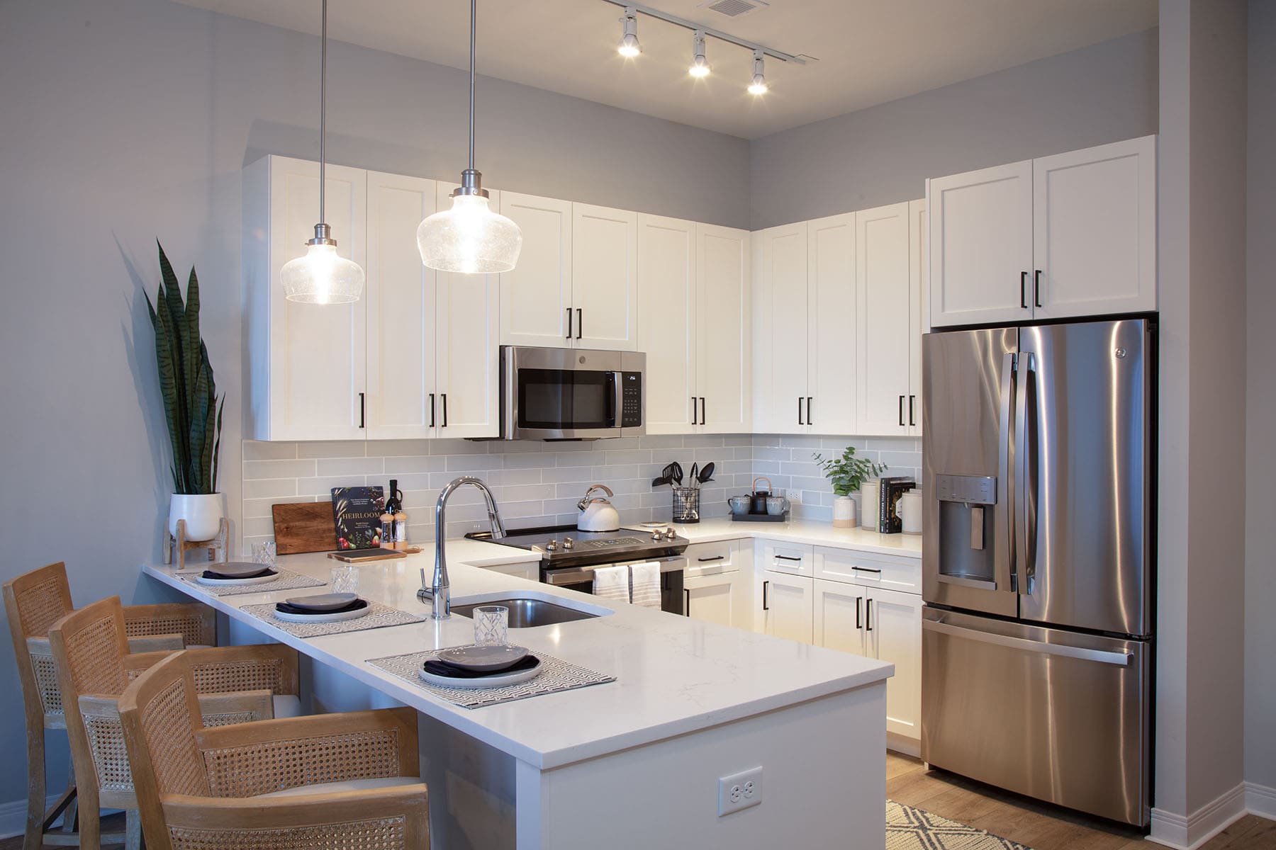 Modern kitchen with dining area in a senior living facility