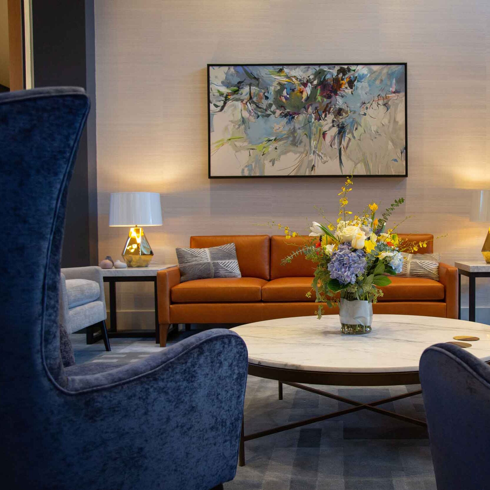 Common area with seating and floral arrangement