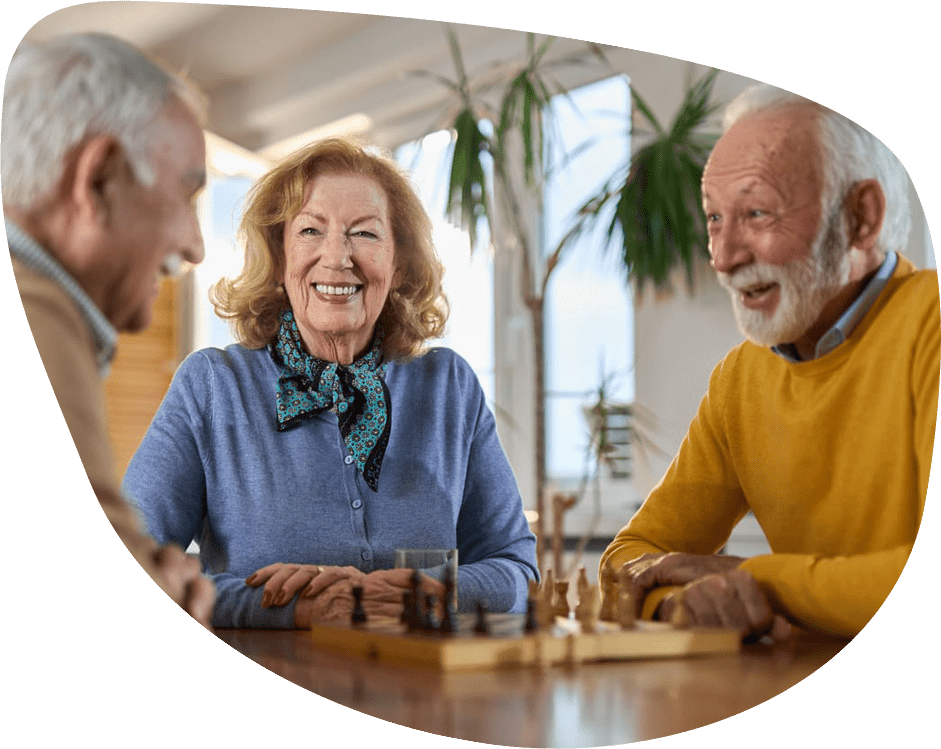 Residents enjoying a game of chess in a common area