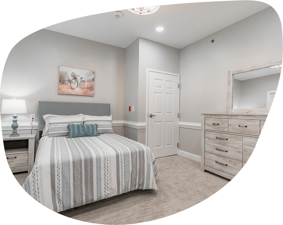 Private resident room with bed and furnishings
