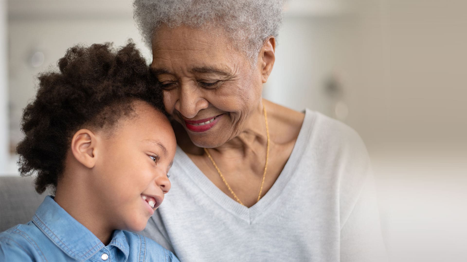 Grandmother and child sharing a joyful moment indoors